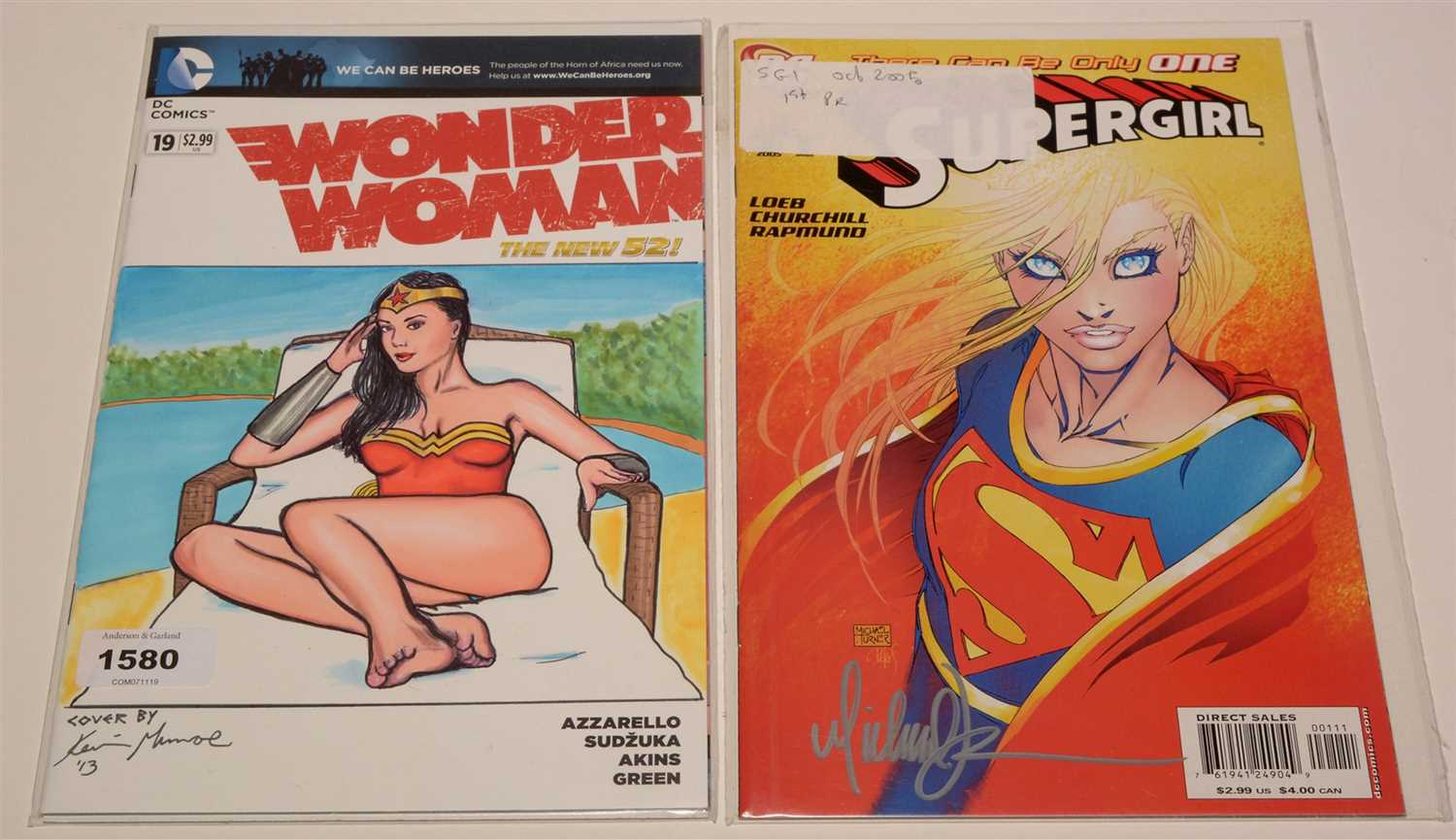 Lot 1580 - Wonder Woman: The New 52! No. 19; and Supergirl No. 1