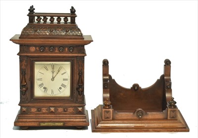 Lot 995 - An early 20th Century German carved walnut bracket clock