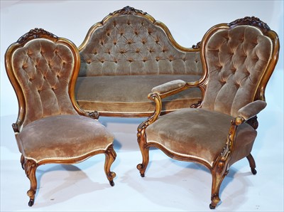 Lot 1248 - A Victorian carved walnut three piece drawing room suite