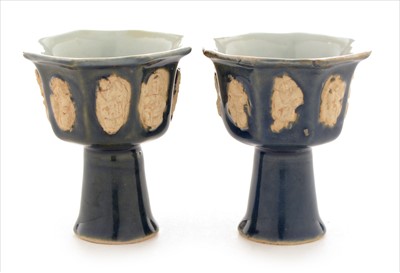 Lot 477 - A pair of Chinese porcelain stem cups.