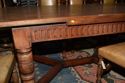 Lot 1157 - A reproduction oak draw leaf refectory style dining table