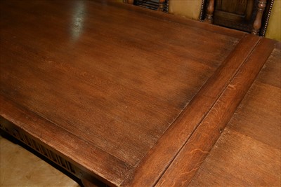 Lot 1157 - A reproduction oak draw leaf refectory style dining table