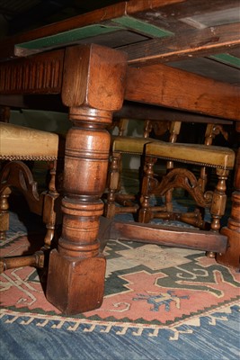 Lot 1157 - A reproduction oak draw leaf refectory style dining table