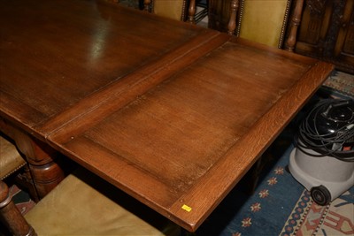Lot 1157 - A reproduction oak draw leaf refectory style dining table