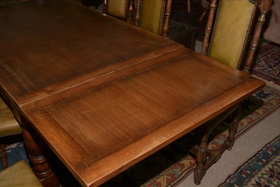 Lot 1157 - A reproduction oak draw leaf refectory style dining table