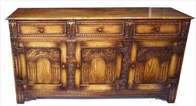 Lot 1159 - A good reproduction carved oak dresser