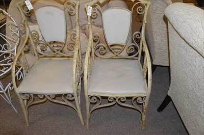 Lot 546 - A pair of cast and wrought iron chairs