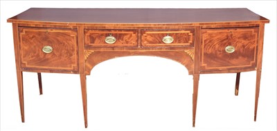 Lot 1230 - A George III mahogany bowfront sideboard.