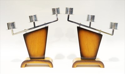 Lot 938 - Pair of stained mahogany and chromed candlesticks