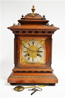 Lot 998 - A German walnut quarter striking bracket clock.