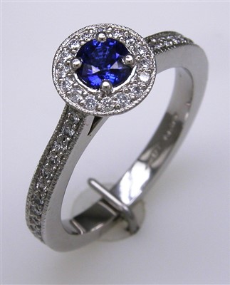 Lot 180 - Sapphire and diamond cluster ring