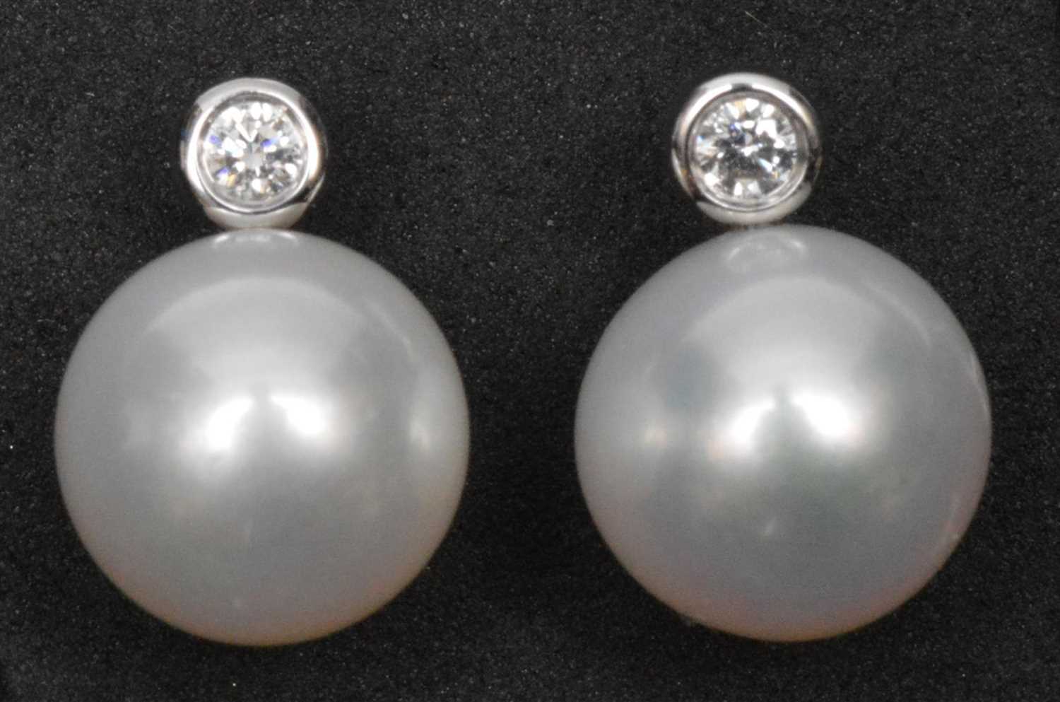 Lot 225 - Pearl and diamond earrings