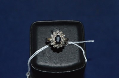 Lot 29 - Sapphire and diamond cluster ring