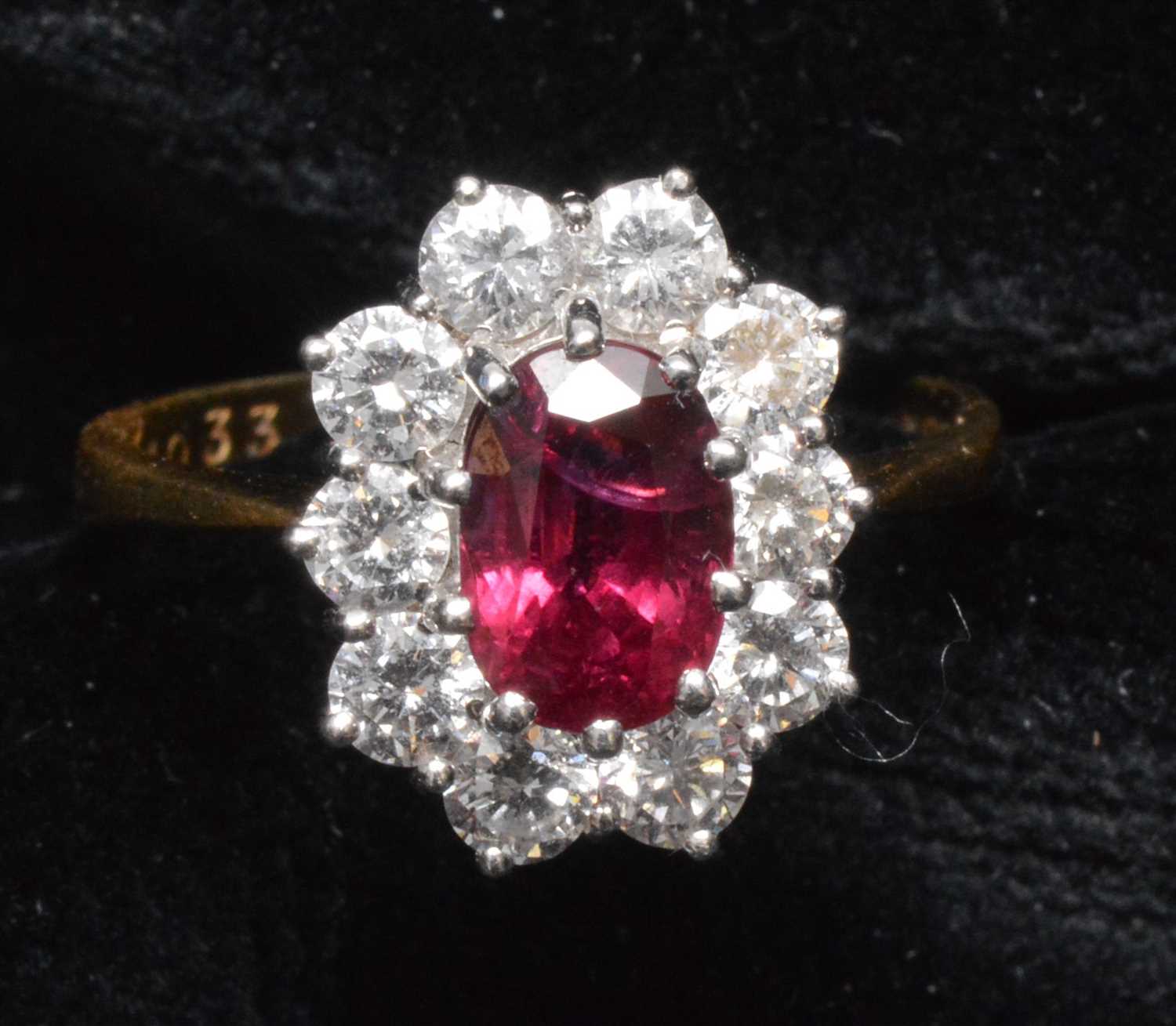 Lot 143 - Ruby and diamond cluster ring