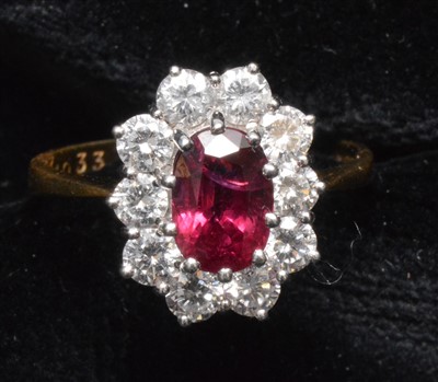 Lot 143 - Ruby and diamond cluster ring