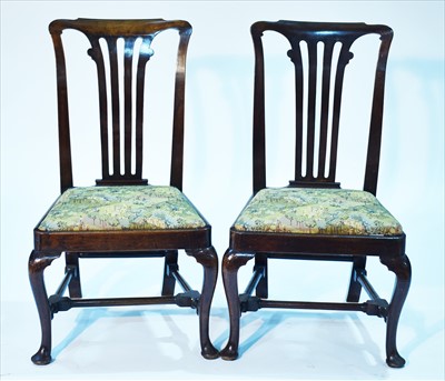 Lot 1194 - A pair of George II walnut dining chairs.