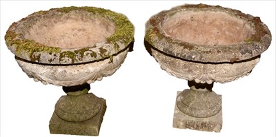 Lot 1091 - A pair of stone urns