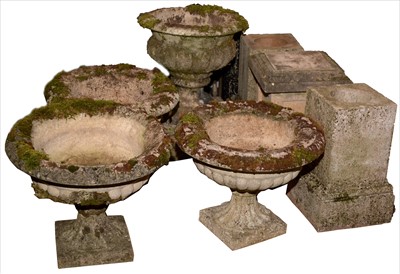 Lot 1097 - Four garden urns and bases