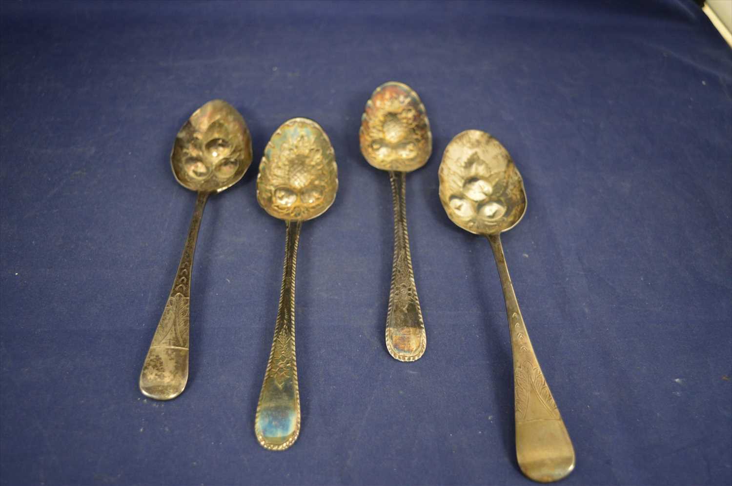 Lot 269 - Four silver berry spoons