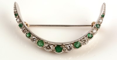 Lot 201 - Emerald and diamond crescent brooch