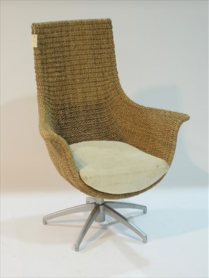 Lot 957 - Modern swivel wicker armchair.