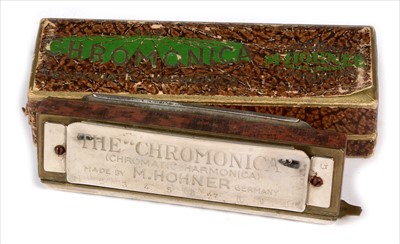 Lot 4 - Melodion and Hohner harmonica.