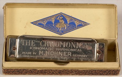 Lot 4 - Melodion and Hohner harmonica.