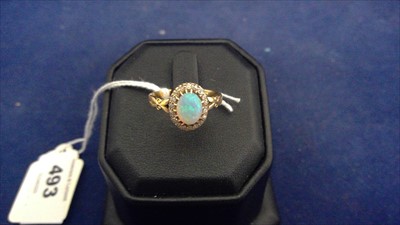 Lot 493 - Opal  and diamond ring
