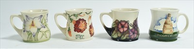 Lot 590 - Four Moorcroft mugs