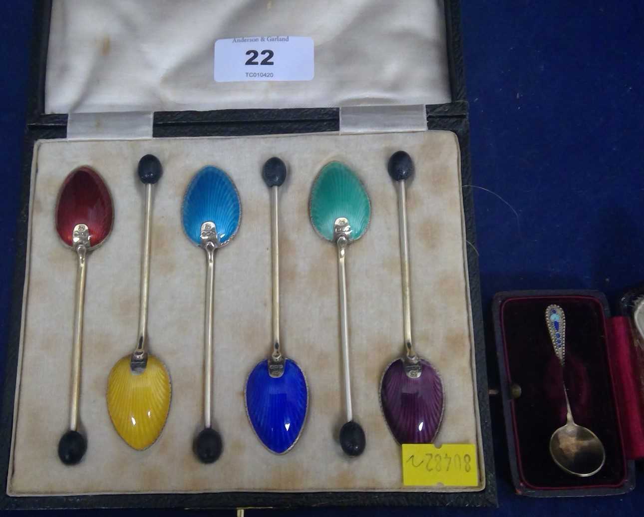 Lot 22 - Silver and enamel coffee spoons and salt spoon