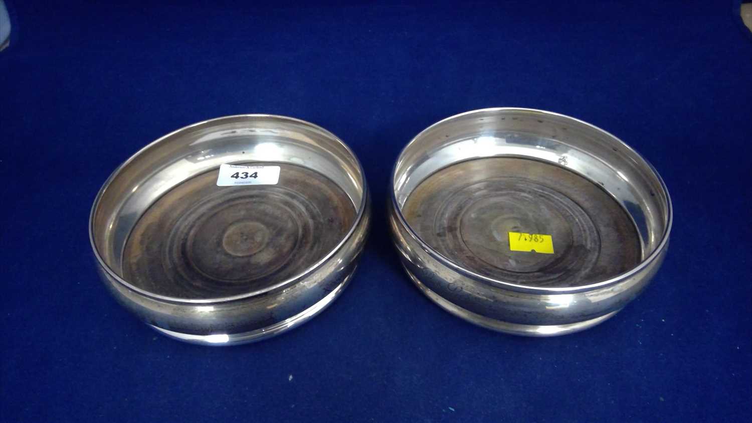 Lot 434 - A pair of silver coasters