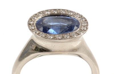Lot 118 - Sapphire and diamond cluster ring
