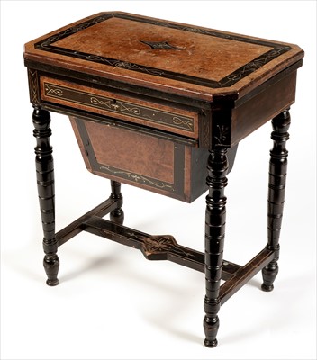 Lot 1039 - A late-Victorian amboyna and ebonised work table