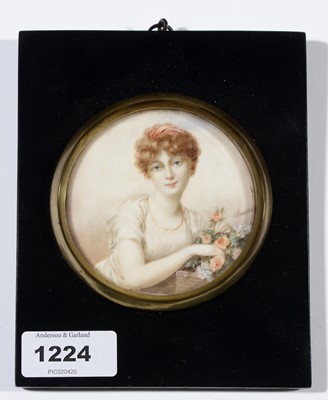 Lot 1224 - 20th Century British School - a miniature bust portrait of a young woman with flowers