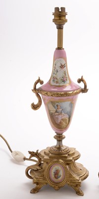 Lot 968 - A pair of Sevres style gilt metal table lamps.
