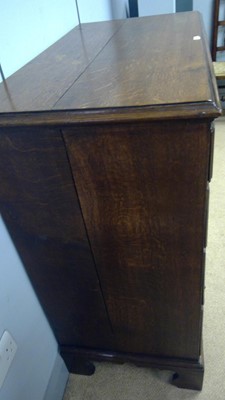 Lot 393 - George III oak chest of drawers