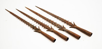 Lot 818 - Four vintage steel fishing spearheads.