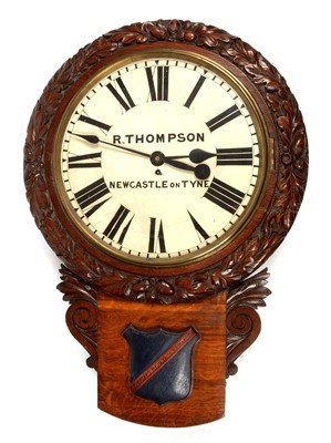 Lot 669 - R Thompson, Newcastle - oak carved drop dial wall clock