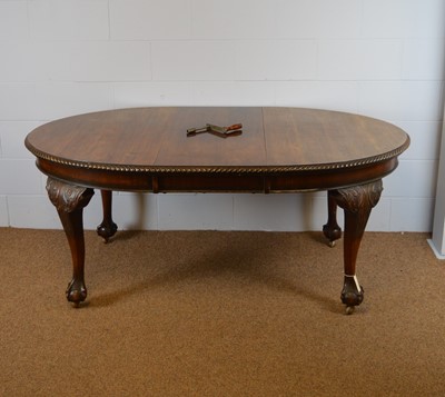 Lot 702 - Oak extending dining table and six chairs