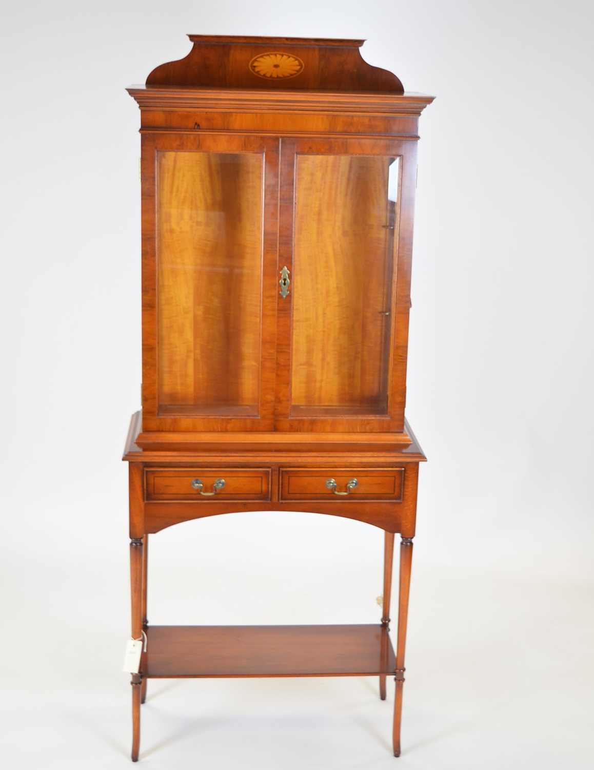Lot 423 - Yew wood display cabinet, chest and side tables.