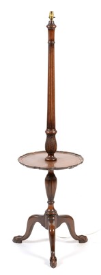 Lot 696 - 20th Century mahogany standard lamp with table