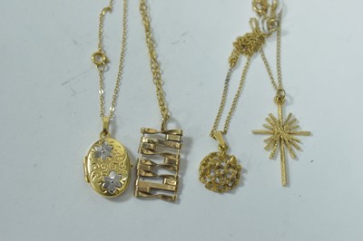 Lot 36 - Four gold pendants on chains