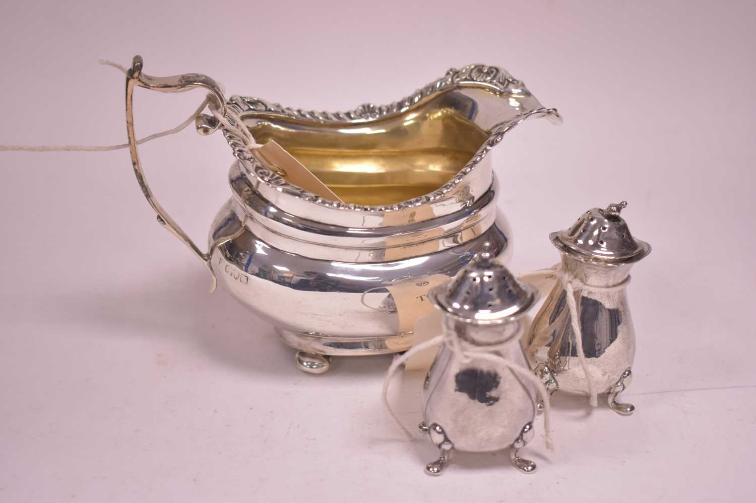 Lot 313 - Silver jug and pepperettes