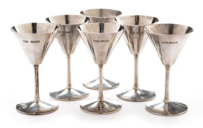 Lot 219 - A set of six silver champagne glasses by Reid & Sons Ltd