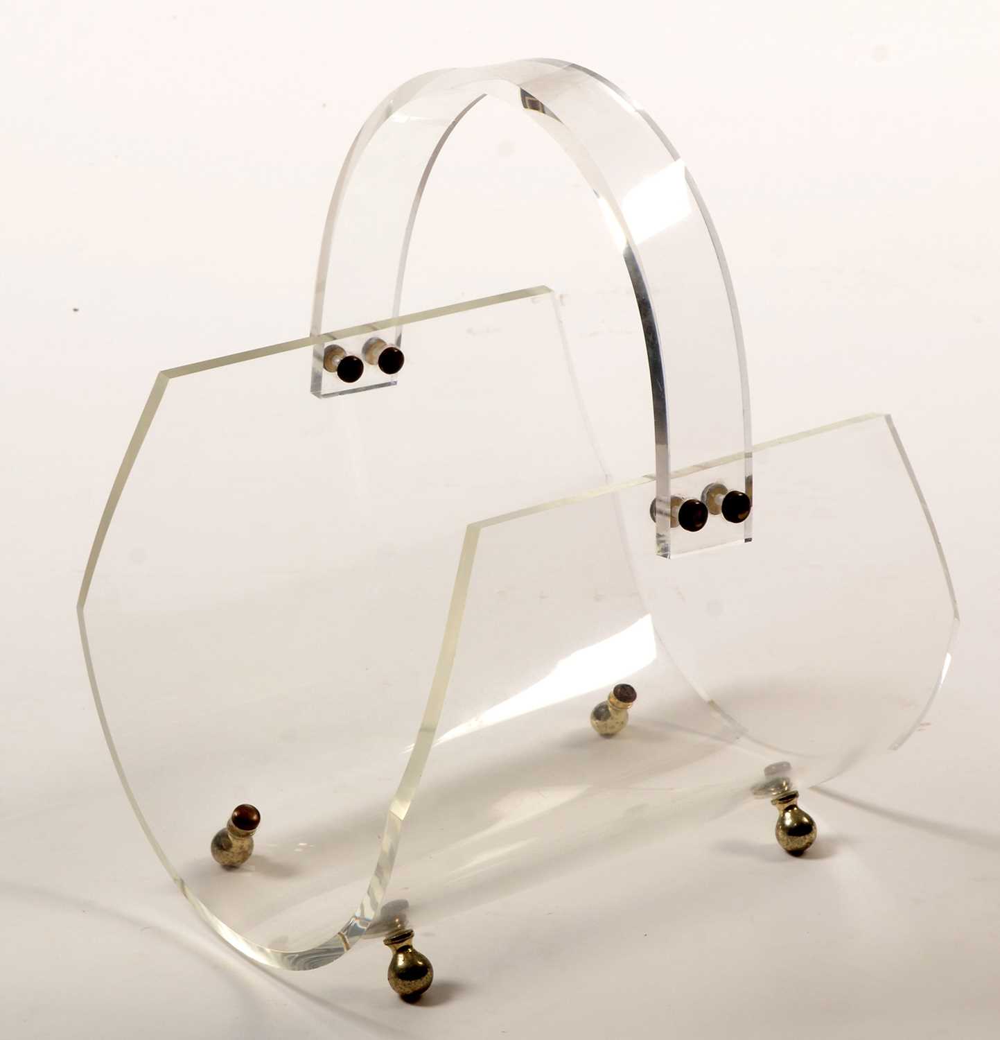 Lot 1143 - A French Lucite magazine holder.