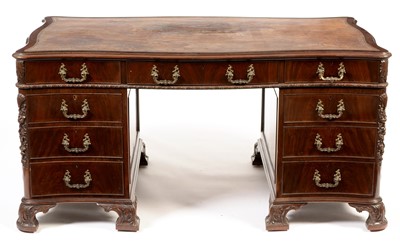 Lot 742 - George III style mahogany serpentine pedestal desk