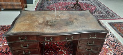 Lot 742 - George III style mahogany serpentine pedestal desk