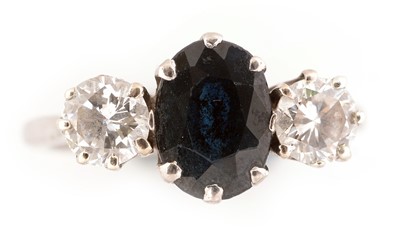 Lot 174 - Three stone sapphire and diamond ring