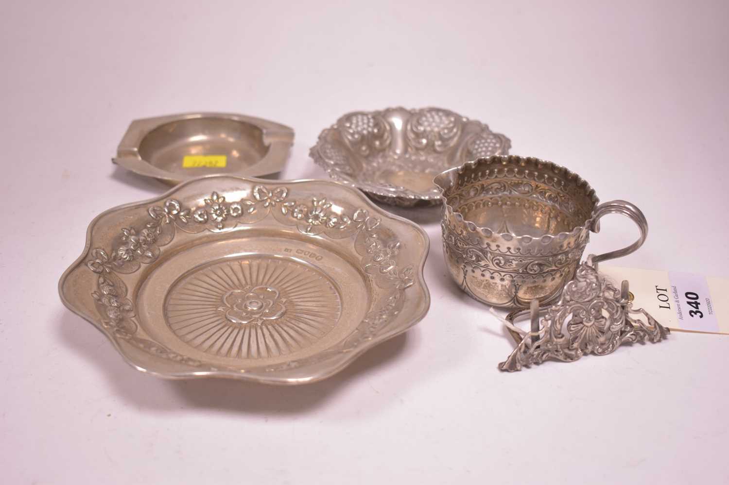 Lot 340 - Two silver dishes, an ash tray, a menu stand and a jug