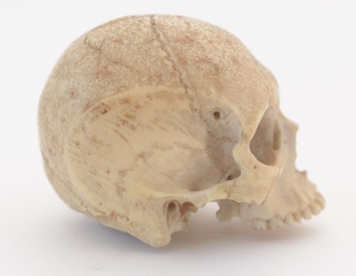 Lot 817 - A rare carved bone skull